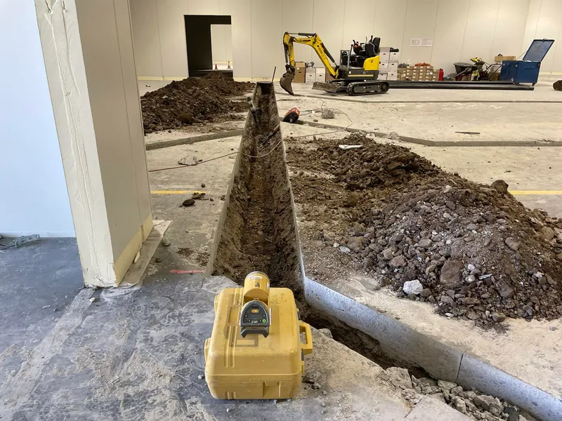 Section of factory floor slab marked out for removal in a Keilor Park unit.